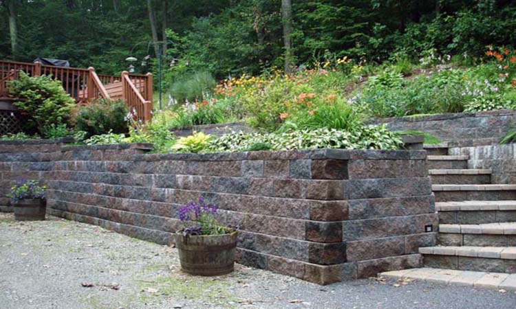 curved_slump_stone_retaining_wall_installation_interlocking_paver_stair_construction