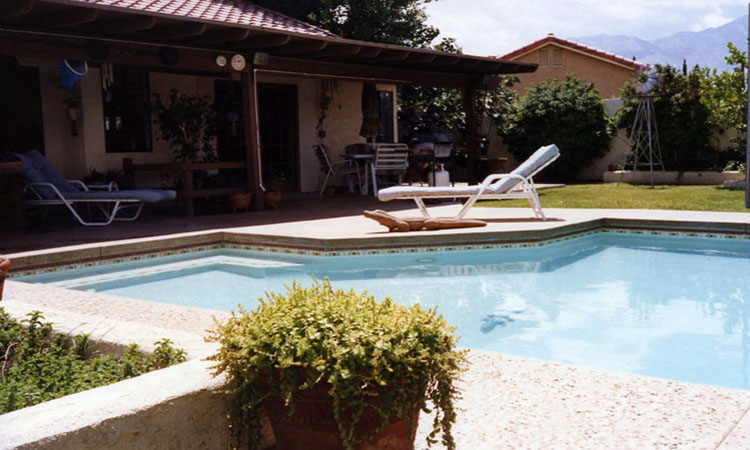 pool_installation_colored_cool_decking_lathe_and_plaster_planters